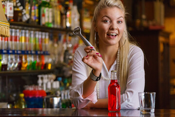 Woman working at the bar counter