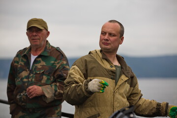 Fototapeta premium Fisherman at work, Sea of Okhotsk.