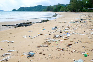 Spilled plastic on the beach. Ecological problem concept
