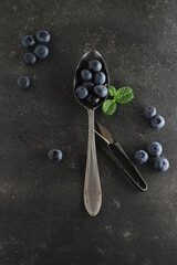 mystic light blueberries on dark background