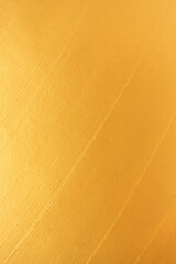 Shiny golden metallic gritter bright backgound texture. Elegant and luxury gold color abstract vertical wallpaper
