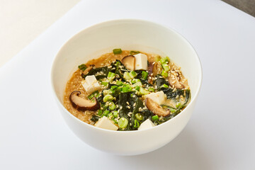 Japanese miso soup in a white bowl - Traditional asian dish