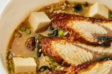 Japanese miso soup with eel in white bowl - Traditional asian dish