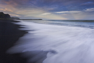 Sunset on the black beach. Iceland.