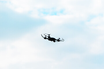 Fototapeta na wymiar The drone on the background of blue sky