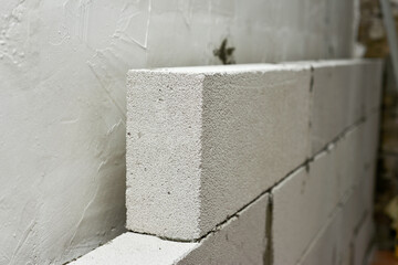 Wall of foam block in a private house, repair and construction do it yourself.