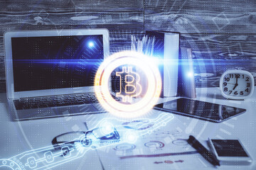 Obraz premium Double exposure of blockchain and crypto economy theme hologram and table with computer background. Concept of bitcoin cryptocurrency.