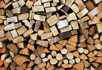 Abstract background (texture) of dry firewood in a pile for furnace kindling.