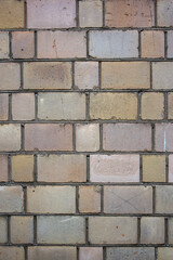 Abstract multicolour brick wall texture for the background. Textured background illustration. Roughly laid brick wall made of old multi-coloured cracked bricks.