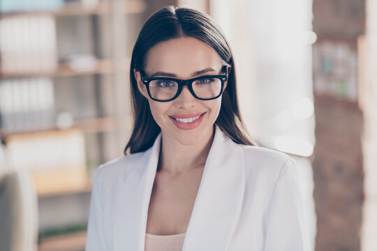 Closeup photo of attractive beautiful business lady eyesight health care concept look clever smart eyes camera toothy smiling home spacious office social distance formalwear blazer indoors