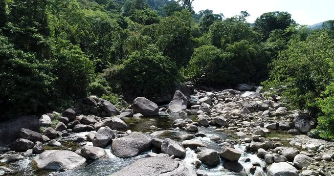 Tropical waterfall rainforest in deep mountain with rocky aerial view