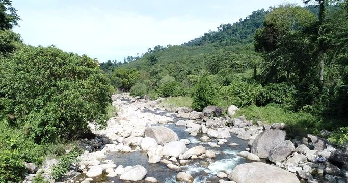 Tropical waterfall rainforest in deep mountain with rocky aerial view