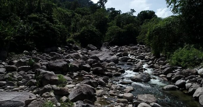 Tropical waterfall rainforest in deep mountain with rocky aerial view