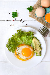 Fried eggs in a ring of yellow bell pepper. Healthy breakfast food. Proper nutrition. The top view