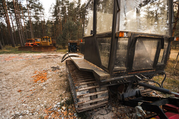 Old rusty tractors in countryside in woods