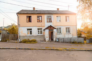 Facade of an old post-Soviet two-story house.