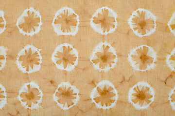 Fragment of hand-dyed fabric strip using shibori dyeing technique