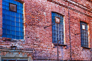 Old abandoned factory made of red brick.