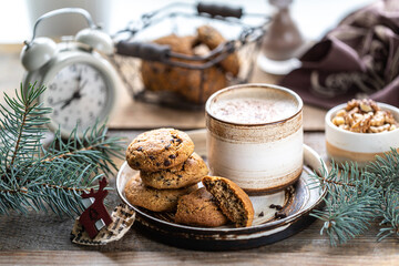 Homemade cookies with nuts and coffee in a ceramic cup