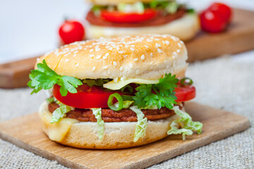Homemade hamburger with fresh vegetables.