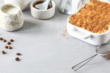 Tiramisu, traditional italian dessert on a white background. Copy space