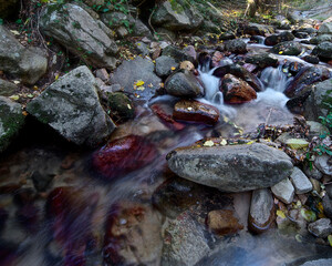 River water flowing through stones