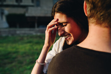 Beautiful young couple have fun. Her happiness is everything to him.