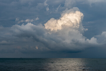 Naklejka na ściany i meble Calm Sea, Black Sea and white clouds on a Blue Sky Background