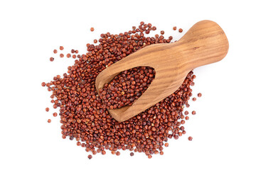 red quinoa seeds in wooden scoop isolated on white background with clipping path and full depth of field. Top view. Flat lay