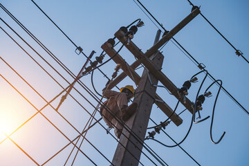 The power lineman uses insutated tool to open the connection of the transformer from the high voltage distribution system. To change the drop out fuse cut out that protects the transformer.