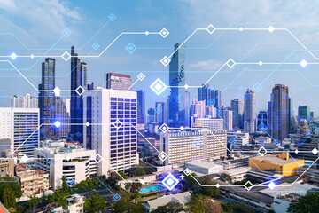 Technology hologram over panorama city view of Bangkok. The largest tech hub in Asia. The concept of developing coding and high-tech science. Double exposure.