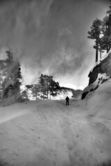 Naklejka premium Person walking through a snow storm