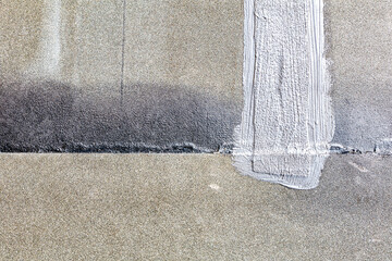 Bitumen felt or tarboard and tar paper on the floor, working progress