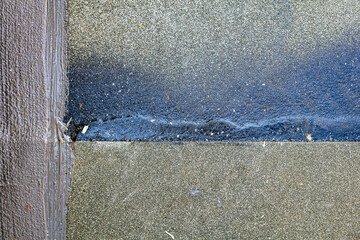 Bitumen felt or tarboard and tar paper on the floor, working progress