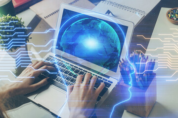 Businessman with computer background with brain theme hologram. Concept of brainstorm. Multi exposure.