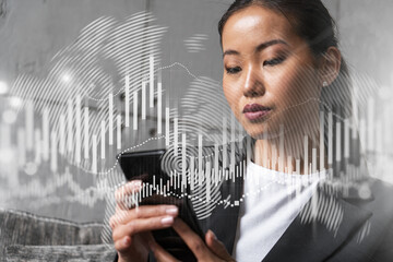 Businesswoman typing phone, work in modern office on new project. forex graph hologram. Double...