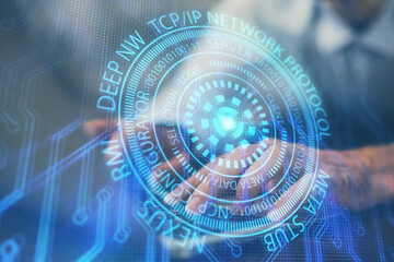 Multi exposure of data internet theme hologram with man working on computer on background. Concept of innovation.