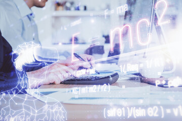 Science formula hologram with man working on computer on background. Education concept. Double exposure.