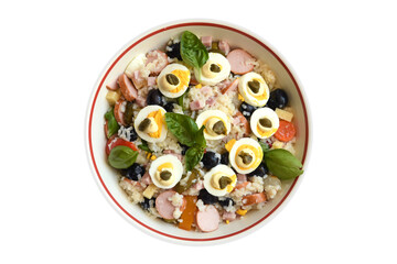 Rice salad with wurstel, cooked ham, cheese, vegetables, boiled eggs and basil on the white plate. view from above. isolated on white.