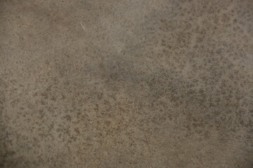 fondo abstracto con manchas grises sobre suelo de cemento