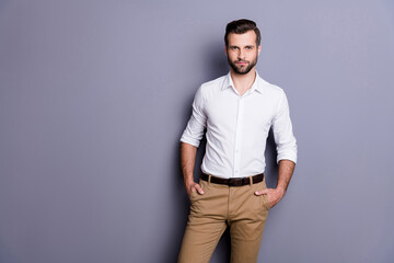 Portrait of reliable minded executive representative marketer man put hands trousers look classy attract charming woman wear white clothes isolated over gray color background