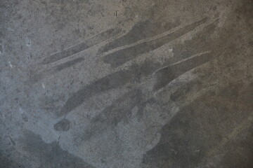 fondo abstracto con manchas grises sobre suelo de cemento