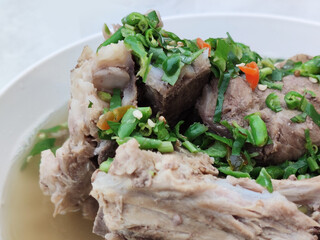 Decorated extremely chilli topping on home made Pork bone spicy soup stew, Variety taste from Street food gourmet restaurant at Thailand open market, food stylist backgrounds 