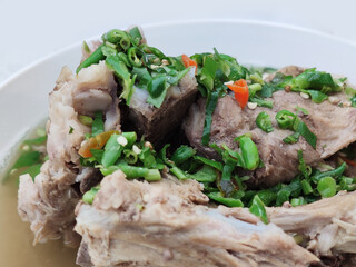 Decorated extremely chilli topping on home made Pork bone spicy soup stew, Variety taste from Street food gourmet restaurant at Thailand open market, food stylist backgrounds 