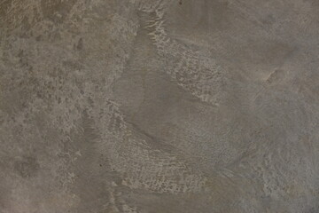 fondo abstracto con manchas grises sobre suelo de cemento