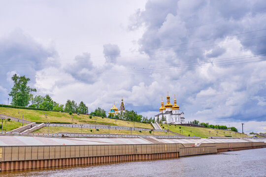 View from Tura river to embankment and Holy Trinity Men Monastery of Russian Orthodox church. Tyumen, Russia