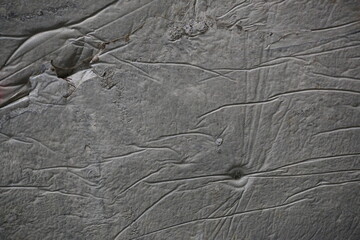 fondo abstracto con manchas grises sobre suelo de cemento