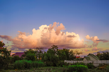 Fototapeta na wymiar Beautiful countryside landscape with dramatic cloudy sky. Evening, sunset, dark.