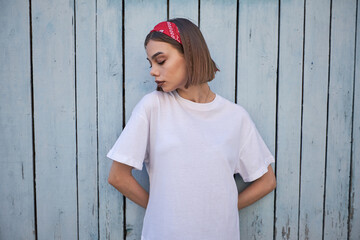 Woman or girl wearing white blank t-shirt with space for your logo, mock up or design in casual...