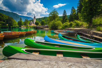 Harbor with rowing boats and colorful canoes, lake Bohinj, Slovenia